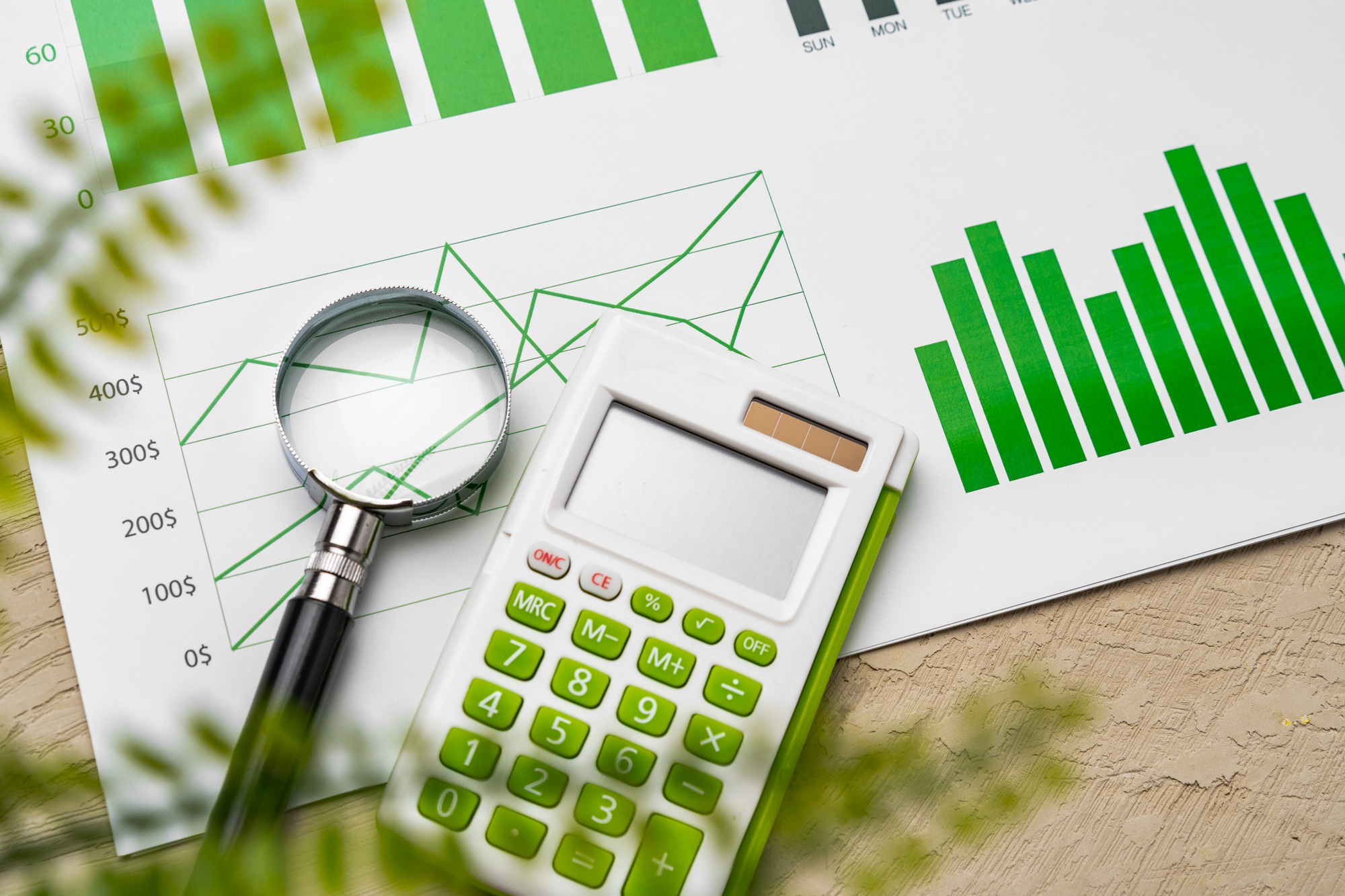 Financial paper with charts and diagrams on gray table