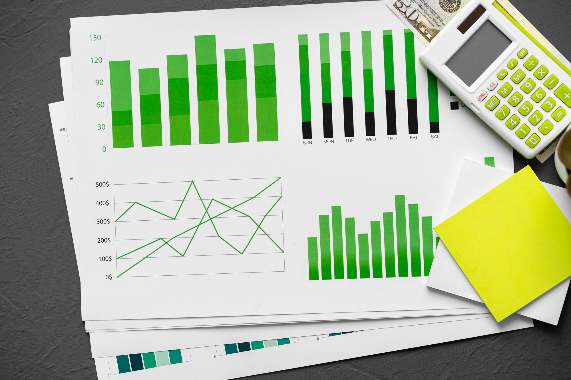 Top view of table with financial papers and calculator